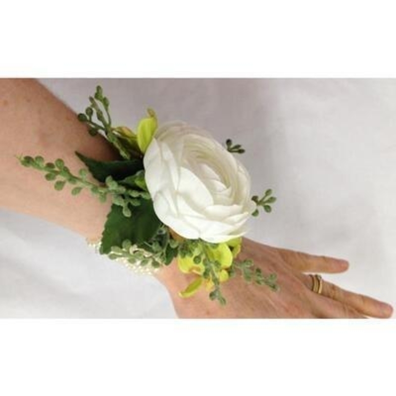This artificial flower wrist corsage if perfect for Prom Parties or Festivals. The flowers are set onto a pearl bracelet.